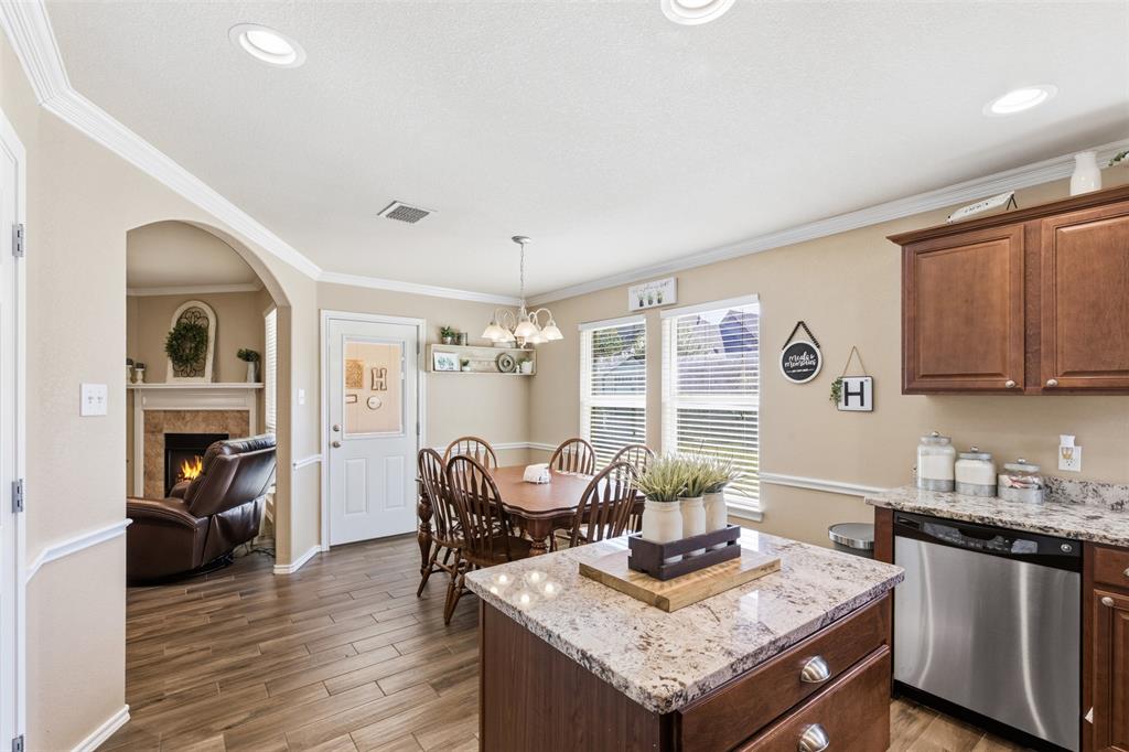 814 Chestnut Grove Drive Cleburne, TX 76033 - Photo 18 of 40 a living room with granite countertop furniture and fireplace