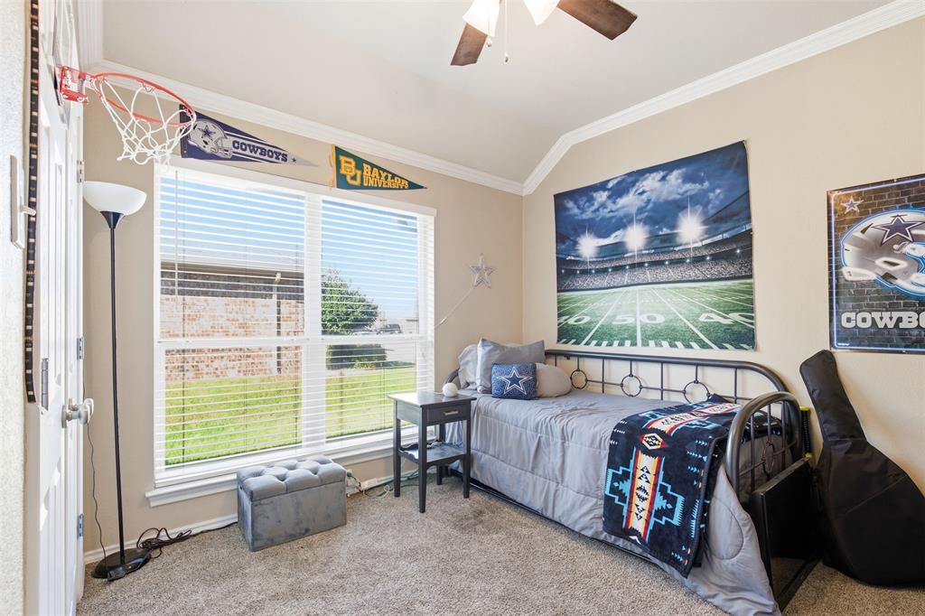 814 Chestnut Grove Drive Cleburne, TX 76033 - Photo 26 of 40 a bedroom with furniture and a large window