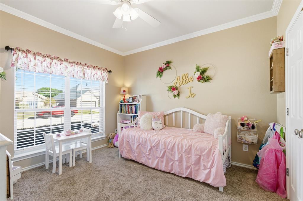 814 Chestnut Grove Drive Cleburne, TX 76033 - Photo 28 of 40 a bedroom with a bed and a table