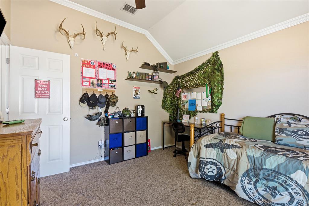 814 Chestnut Grove Drive Cleburne, TX 76033 - Photo 31 of 40 a living room with furniture and a flat screen tv