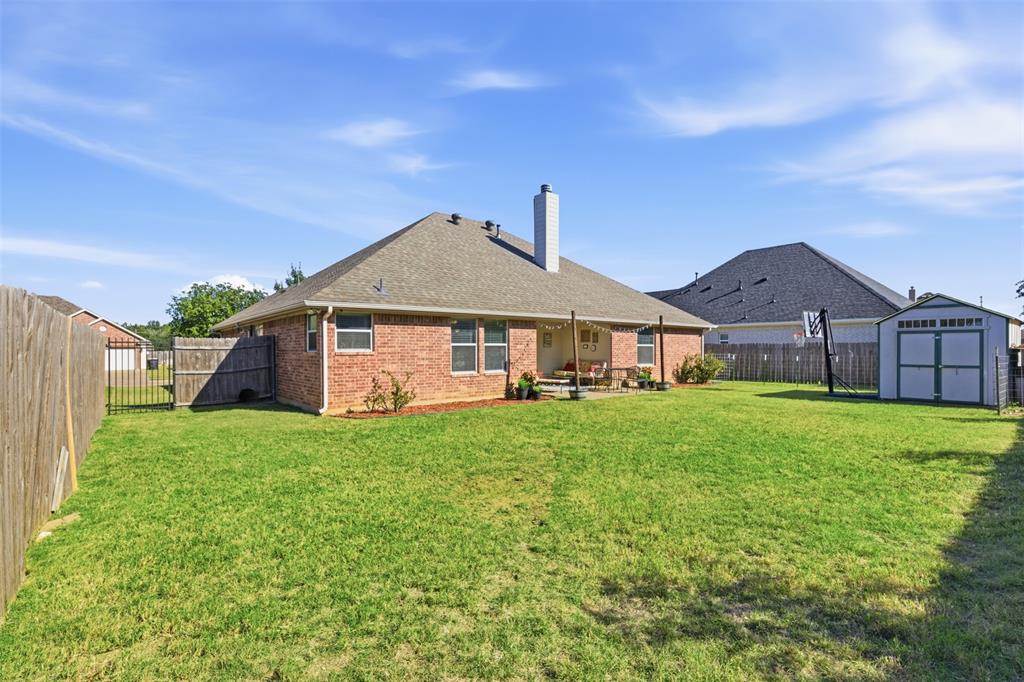 814 Chestnut Grove Drive Cleburne, TX 76033 - Photo 37 of 40 a front view of a house with garden