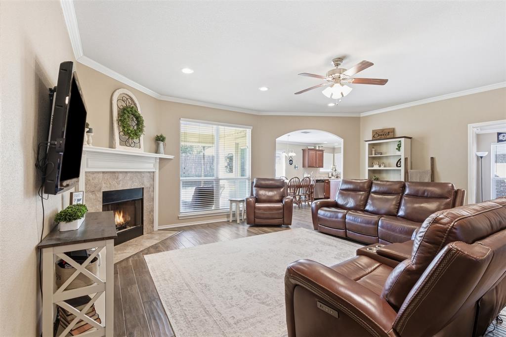 814 Chestnut Grove Drive Cleburne, TX 76033 - Photo 10 of 40 a living room with furniture fireplace and flat screen tv