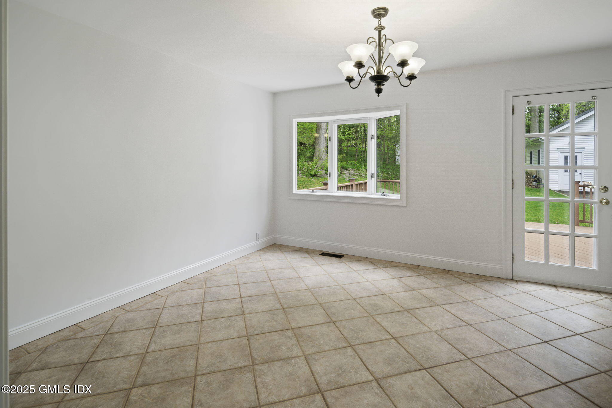 33 Circle Drive Greenwich, CT 06830 - Photo 12 of 22 a view of an empty room with a window