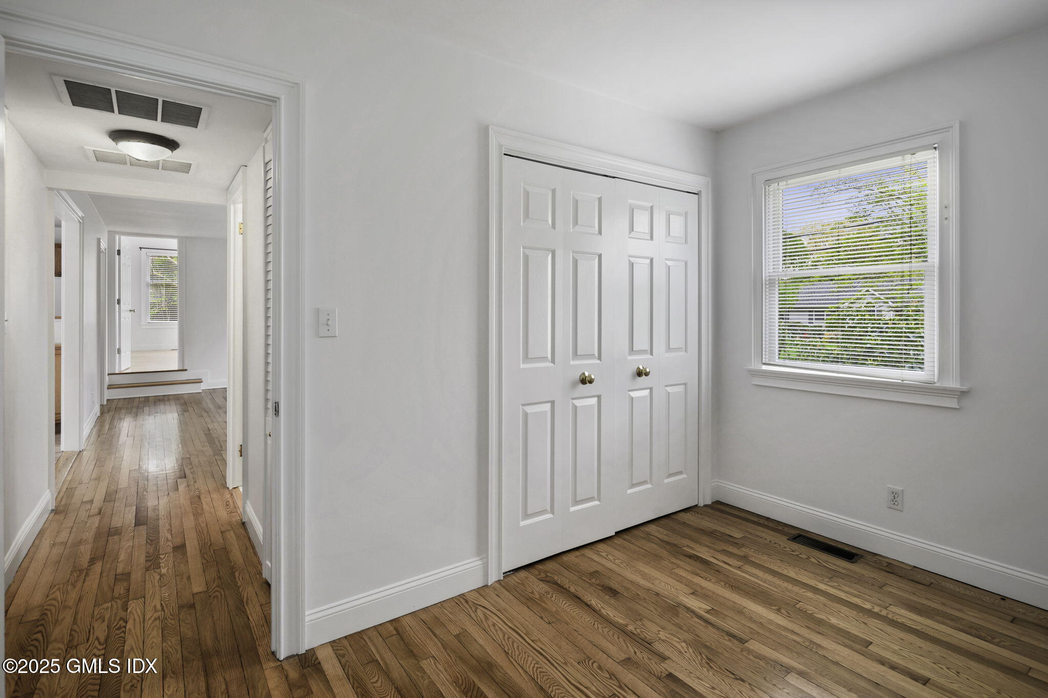 33 Circle Drive Greenwich, CT 06830 - Photo 13 of 22 a view of a room with wooden floor and windows