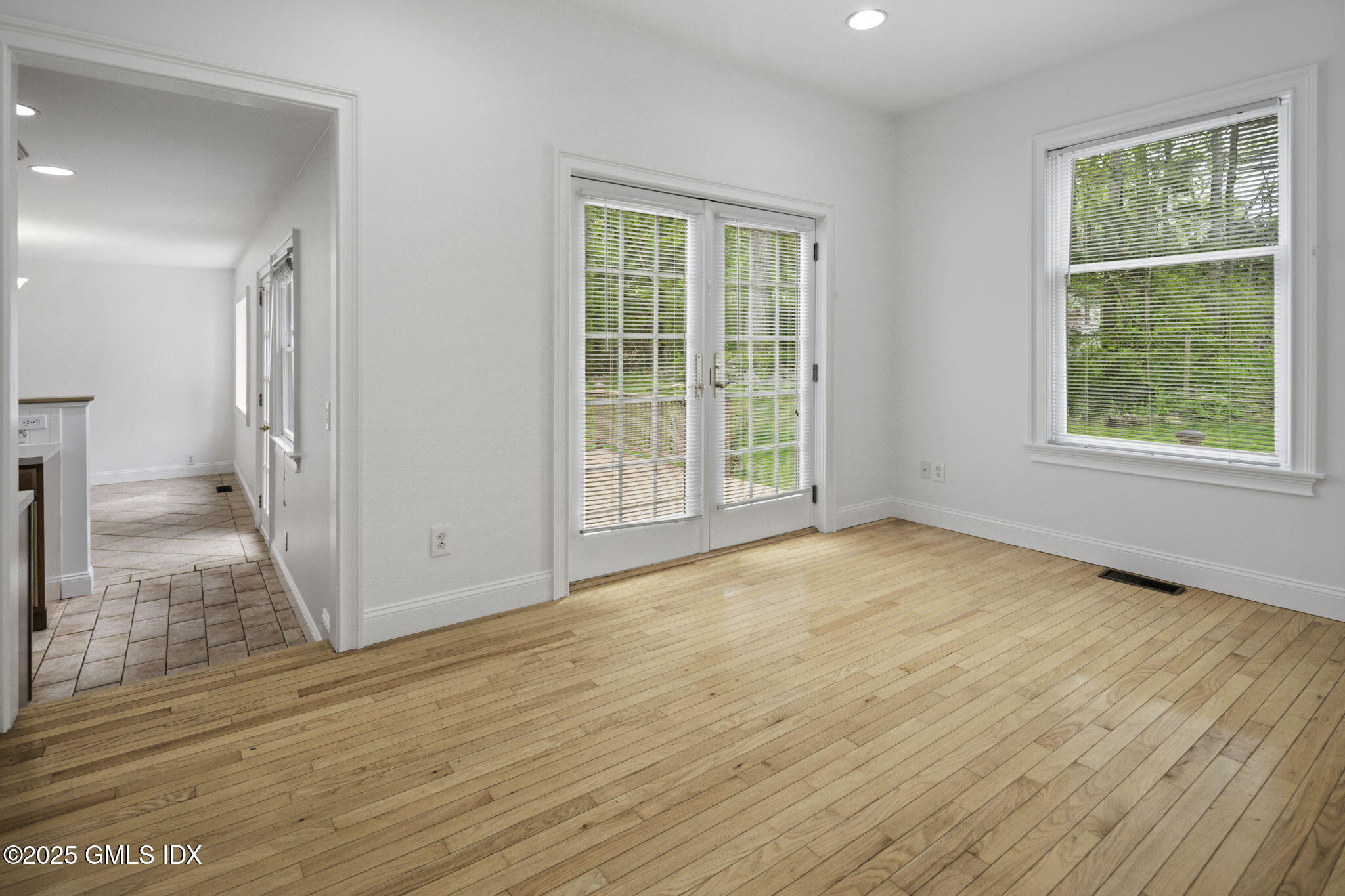 33 Circle Drive Greenwich, CT 06830 - Photo 16 of 22 a view of an empty room with wooden floor and a window