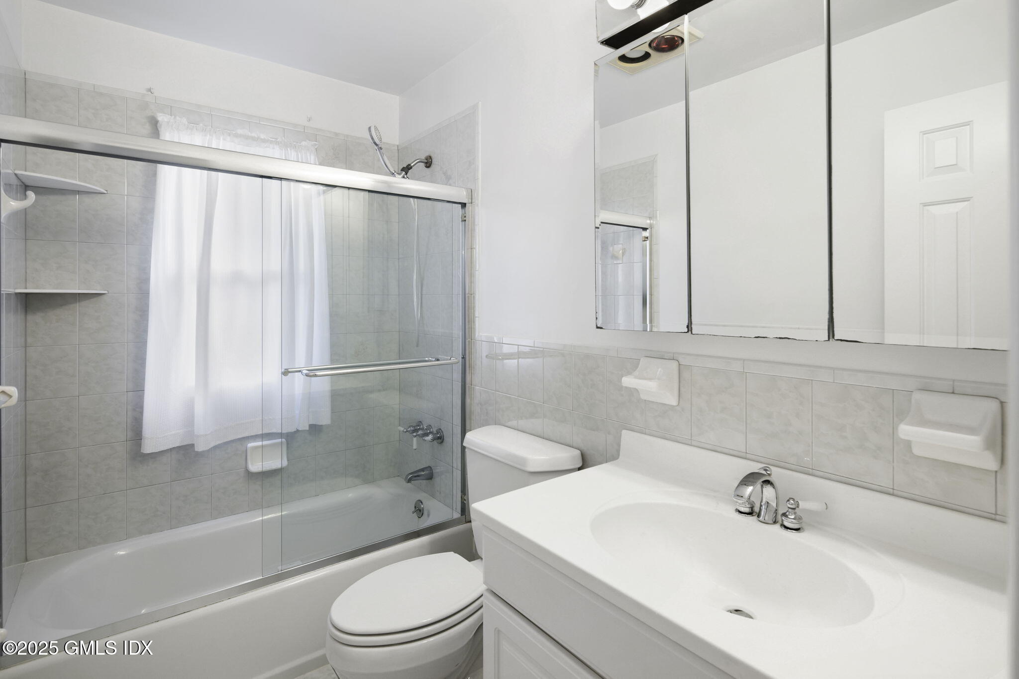 33 Circle Drive Greenwich, CT 06830 - Photo 17 of 22 a bathroom with a sink toilet and shower