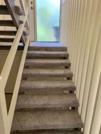 a en suite bathroom with a sink a toilet and a mirror
