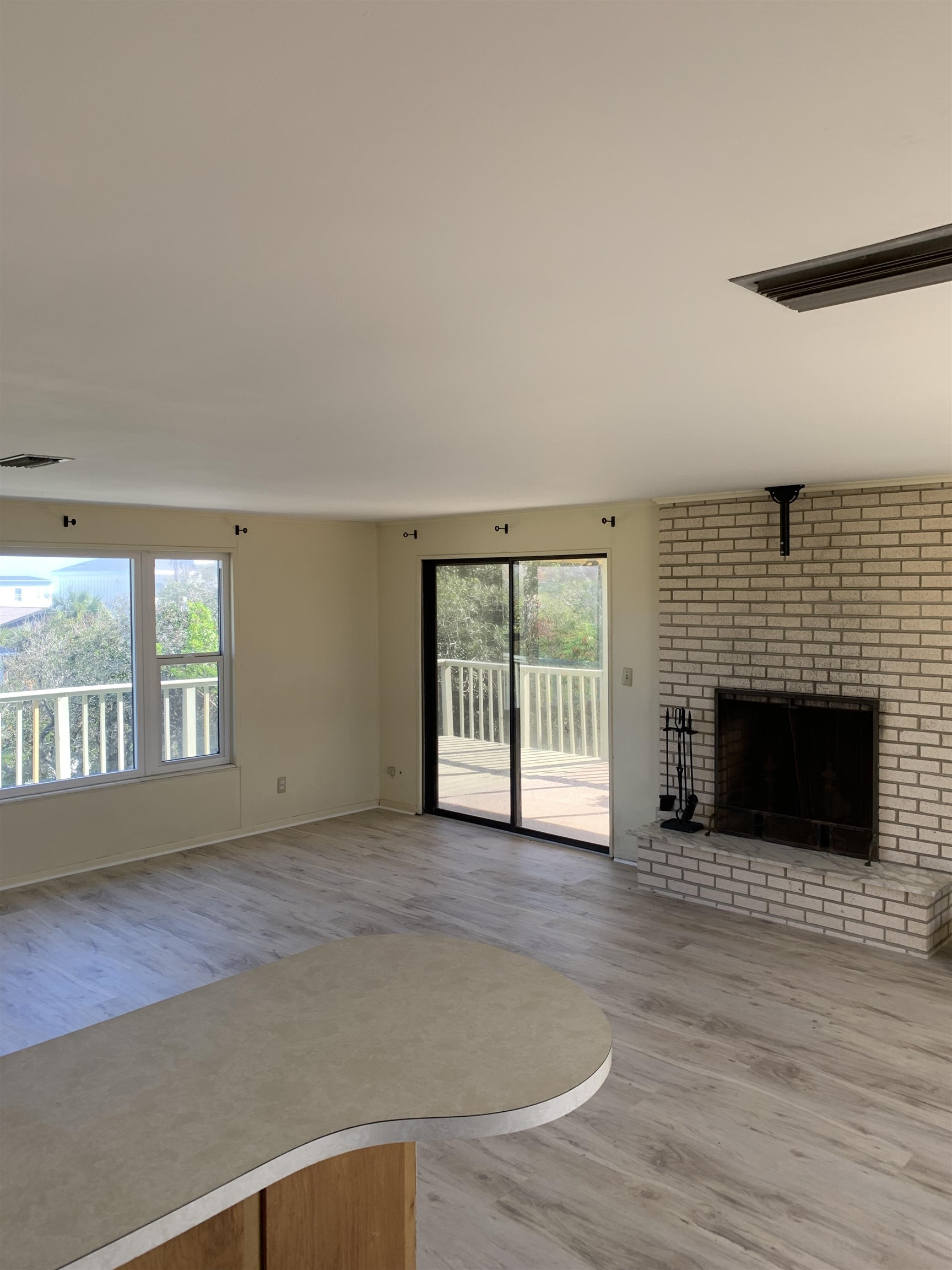 5343 Pelican Way St. Augustine, FL 32080 - Photo 26 of 29 an empty room with windows and fireplace