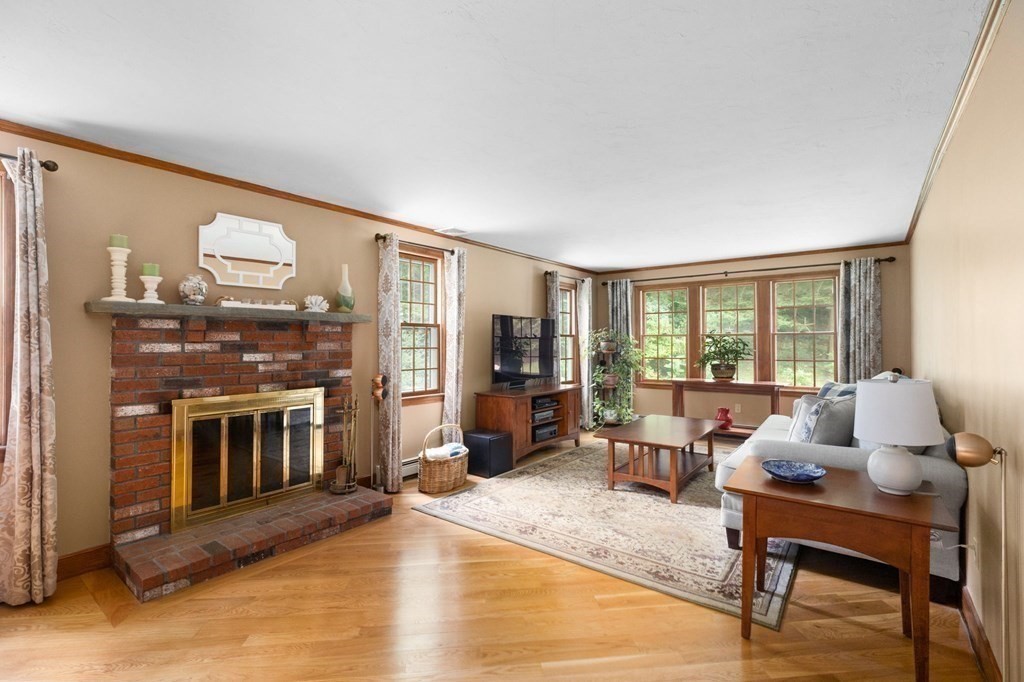 271 Pine Street Marshfield, MA 02050 - Photo 13 of 41 a living room with furniture and a fireplace