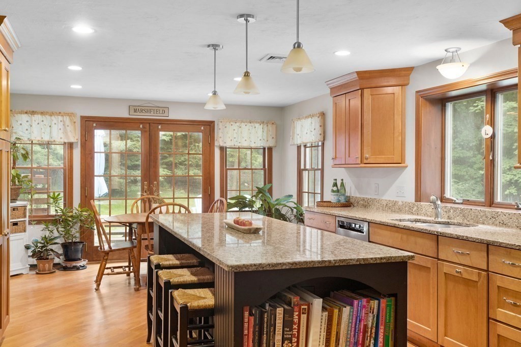 271 Pine Street Marshfield, MA 02050 - Photo 2 of 41 a very nice looking kitchen with granite countertop a large window and stainless steel appliances