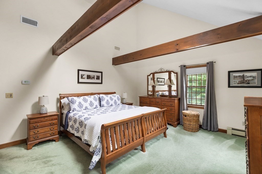 271 Pine Street Marshfield, MA 02050 - Photo 23 of 41 a bedroom with a bed chandelier and a window
