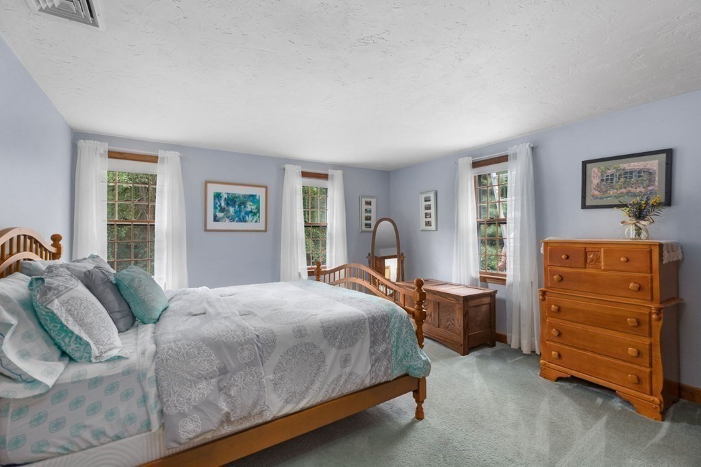 271 Pine Street Marshfield, MA 02050 - Photo 28 of 41 a bedroom with a bed and a dresser