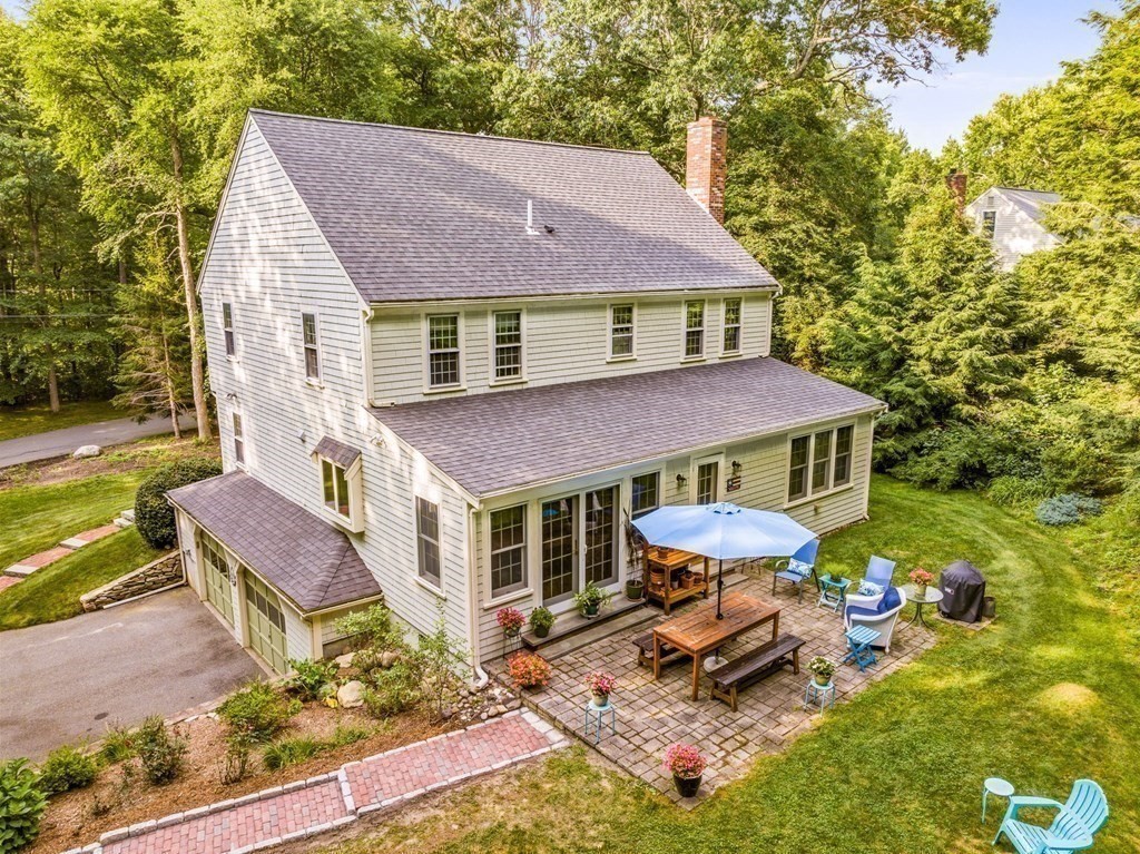 271 Pine Street Marshfield, MA 02050 - Photo 33 of 41 a aerial view of a house with table and chairs under an umbrella