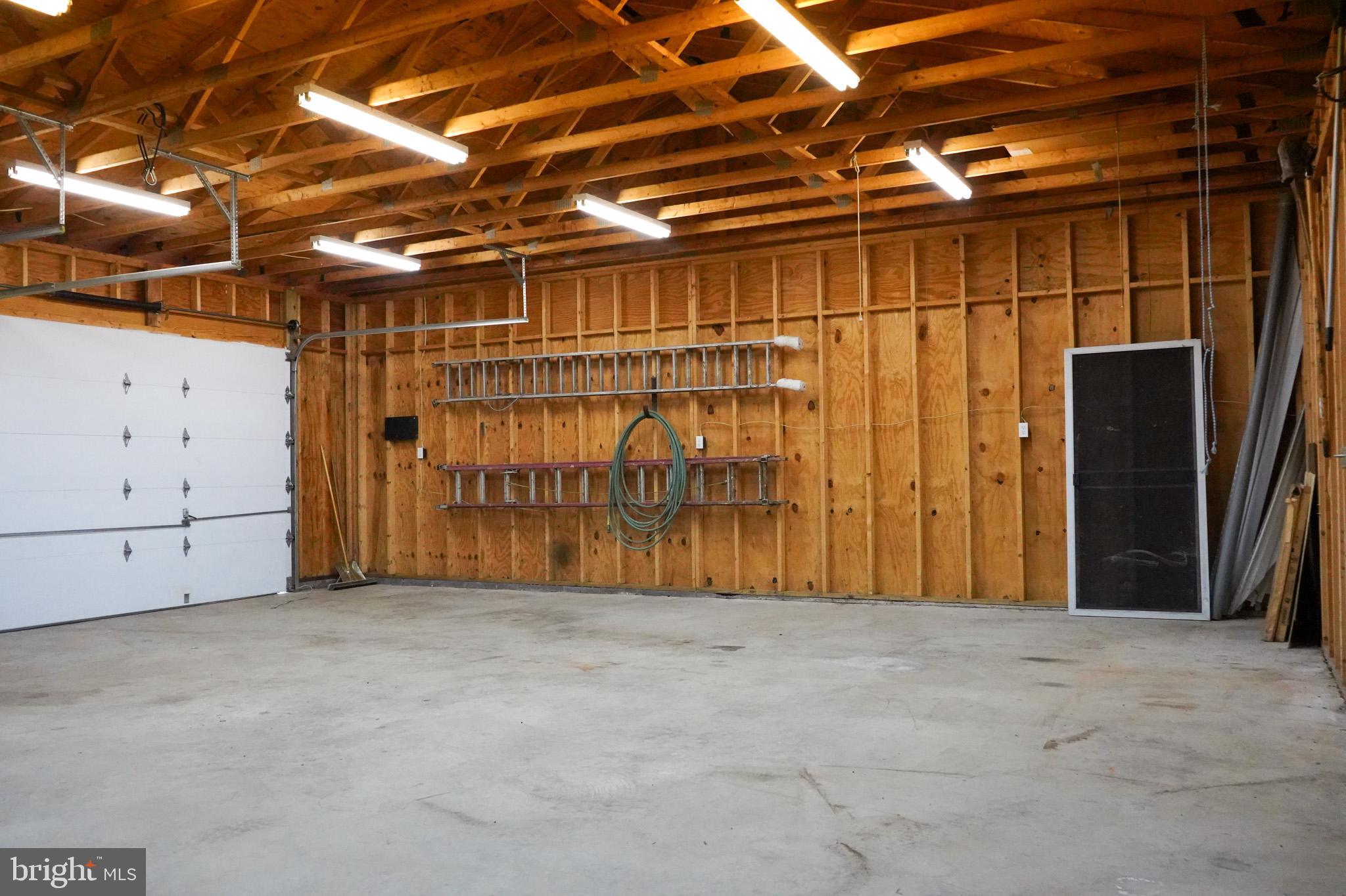 7323 O'Keefe Road Bealeton, VA 22712 - Photo 42 of 48 Spacious garage with ample storage options.