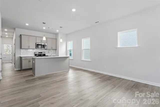 a view of kitchen with wooden floor