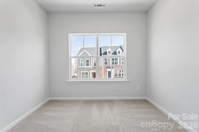 a bathroom with a granite countertop sink toilet a mirror and shower