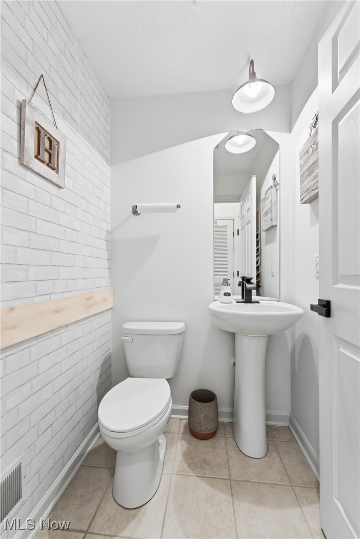 4038 Gardiner Run Akron, OH 44321 - Photo 8 of 38 Half bathroom featuring light tile patterned floors