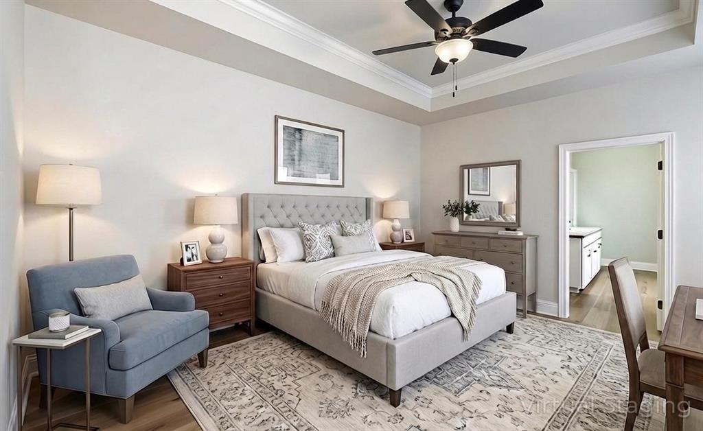 331 Hummingbird Lane Princeton, LA 71067 - Photo 14 of 34 AI Virtually added some staging. Bedroom with wood finished floors, crown molding, a ceiling fan, and a tray ceiling