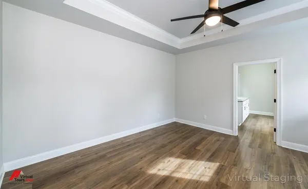 a bedroom with a bed and a lamp