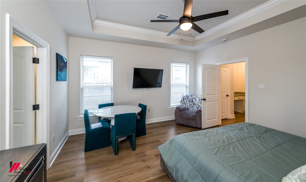 331 Hummingbird Lane Princeton, LA 71067 - Photo 17 of 34 Bedroom featuring wood finished floors, ornamental molding, a ceiling fan, and a raised ceiling