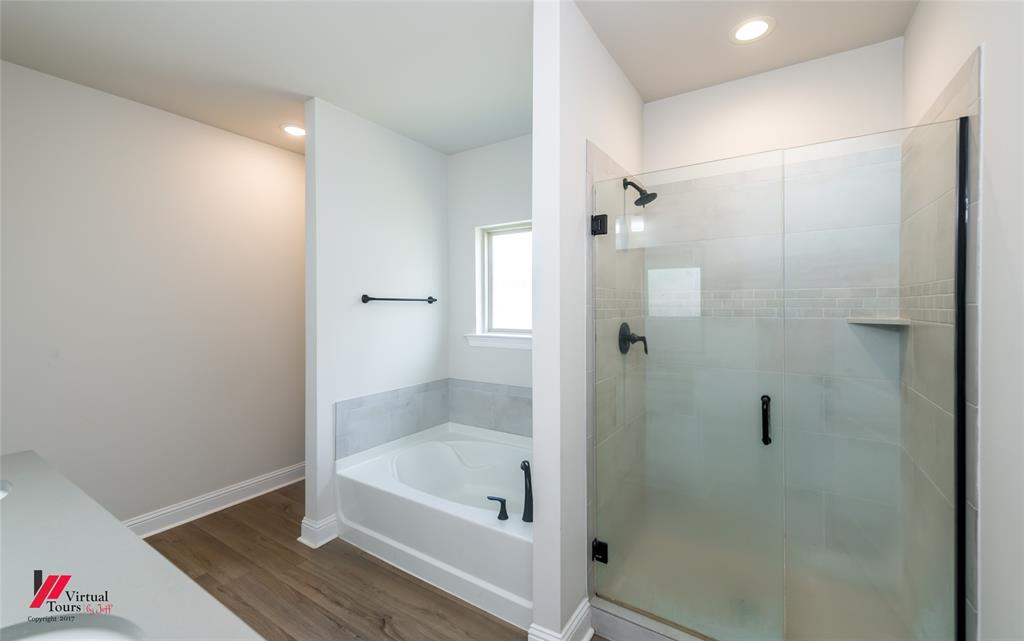 331 Hummingbird Lane Princeton, LA 71067 - Photo 20 of 34 Full bath featuring vanity, a shower stall, a garden tub, dark wood-style floors, and recessed lighting