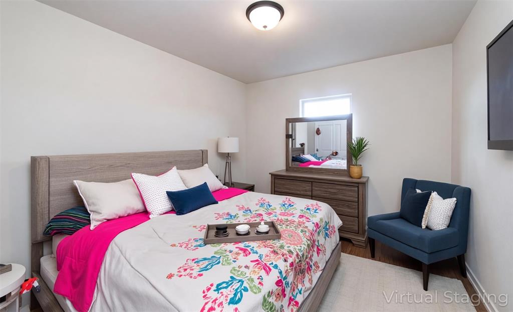 331 Hummingbird Lane Princeton, LA 71067 - Photo 24 of 34 AI Virtually added some staging. Bedroom with wood finished floors