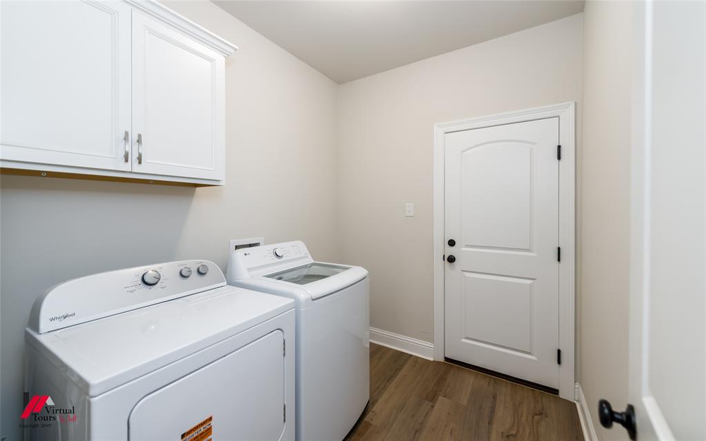 331 Hummingbird Lane Princeton, LA 71067 - Photo 28 of 34 Laundry room featuring dark wood finished floors, washer and dryer, and cabinet space