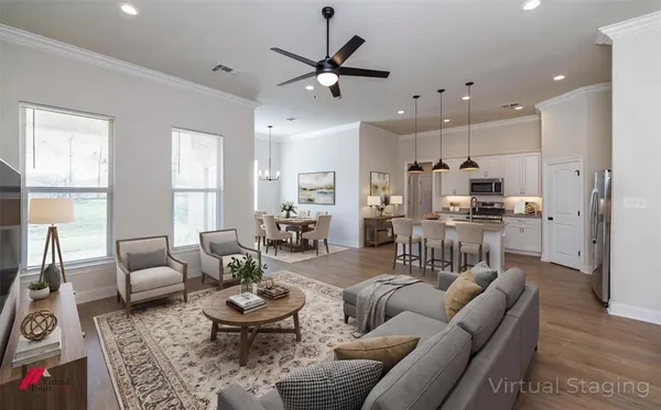 a kitchen with stainless steel appliances kitchen island a sink a stove and chairs