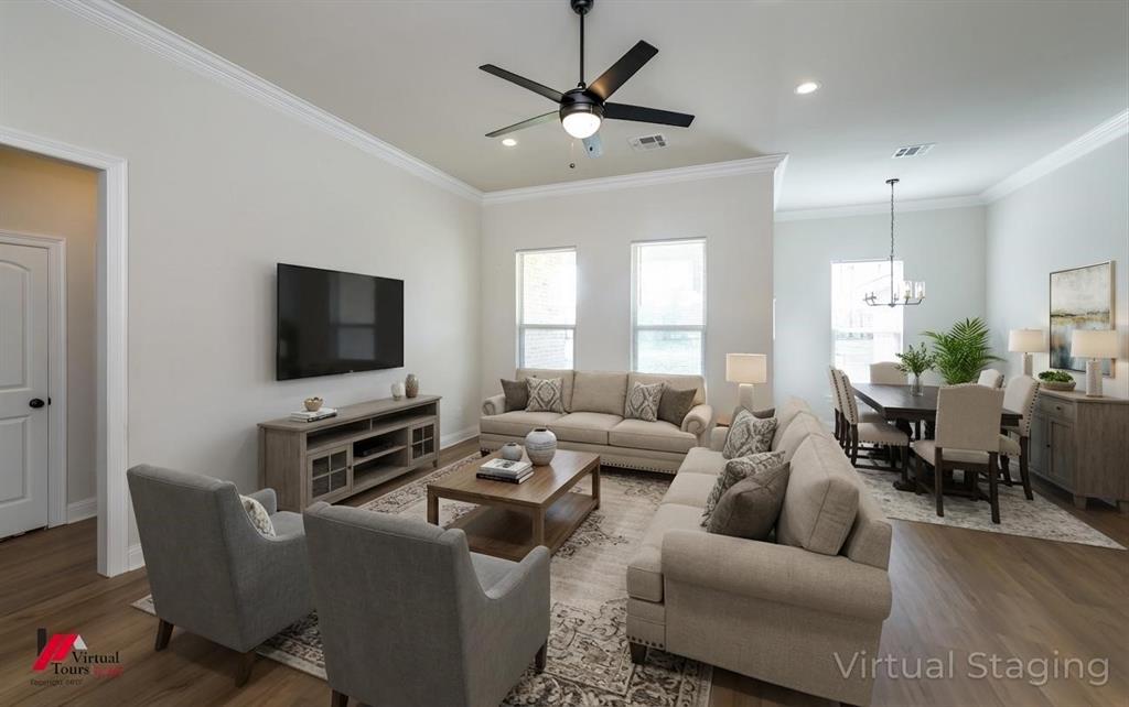 331 Hummingbird Lane Princeton, LA 71067 - Photo 9 of 34 AI Virtually added some staging. Living area with a ceiling fan, a chandelier, dark wood finished floors, and crown molding