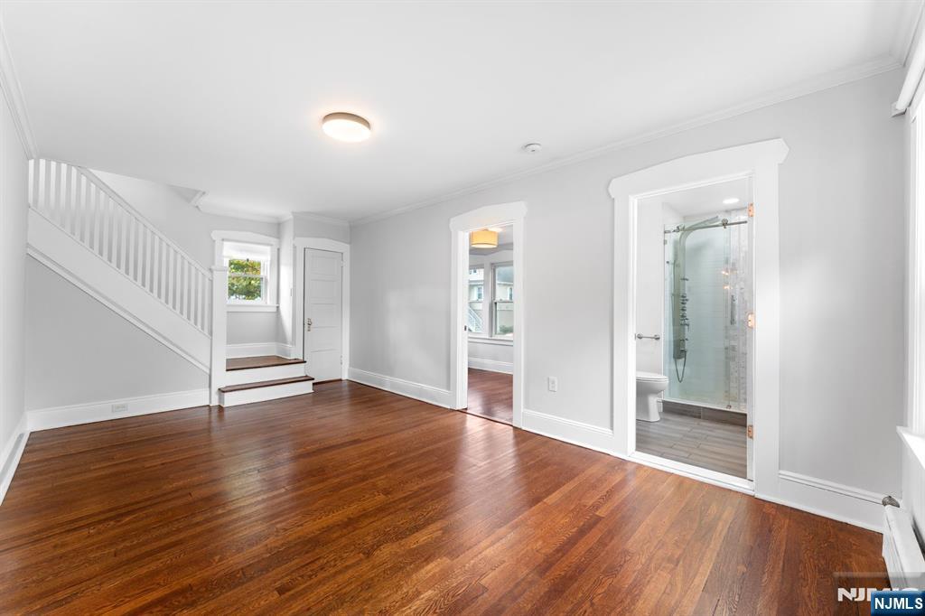 177 East Pierrepont Avenue Rutherford, NJ 07070 - Photo 7 of 27 wooden floor in an empty room with a window