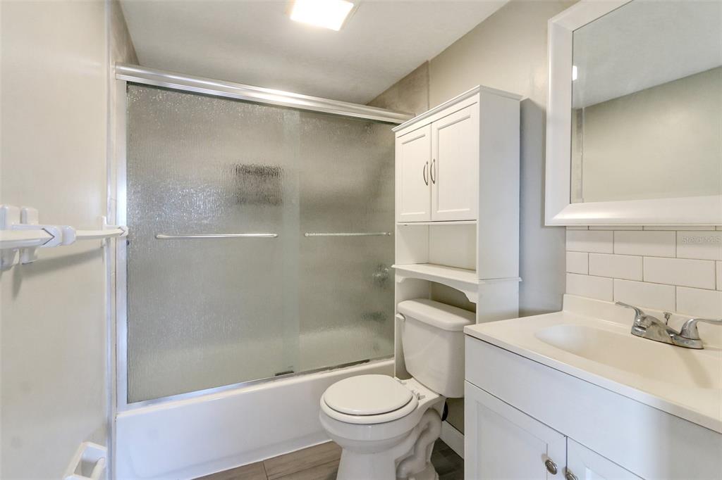 922 Lake Destiny Road, Unit E Altamonte Springs, FL 32714 - Photo 12 of 24 a bathroom with a granite countertop sink toilet and shower