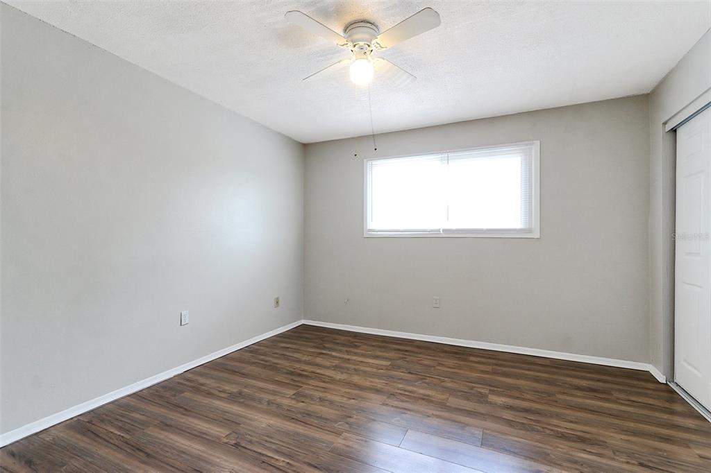 922 Lake Destiny Road, Unit E Altamonte Springs, FL 32714 - Photo 17 of 24 wooden floor in an empty room with a window