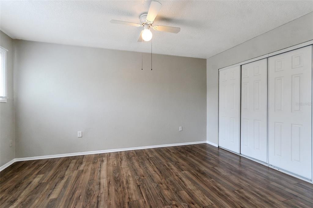 922 Lake Destiny Road, Unit E Altamonte Springs, FL 32714 - Photo 20 of 24 a view of an empty room with wooden floor
