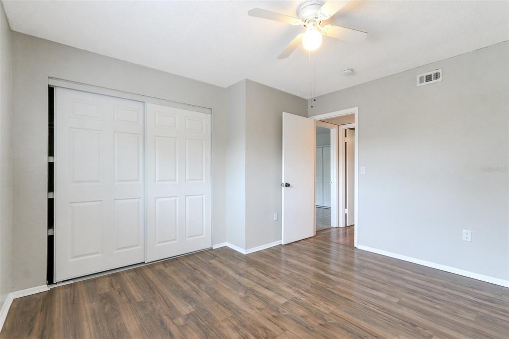 922 Lake Destiny Road, Unit E Altamonte Springs, FL 32714 - Photo 21 of 24 a view of an empty room with wooden floor