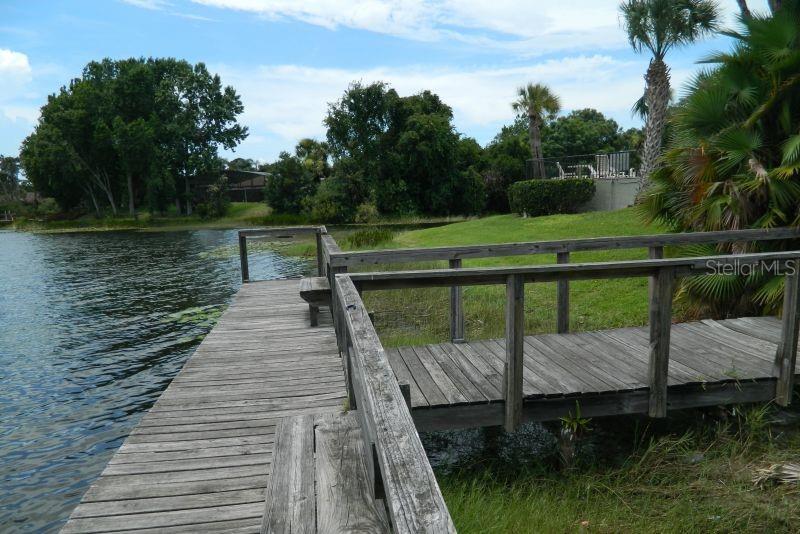 922 Lake Destiny Road, Unit E Altamonte Springs, FL 32714 - Photo 3 of 24 a view of a wooden deck and lake