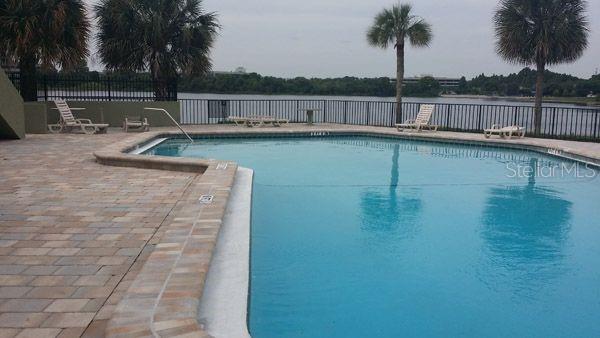 922 Lake Destiny Road, Unit E Altamonte Springs, FL 32714 - Photo 8 of 24 a view of a swimming pool with a yard