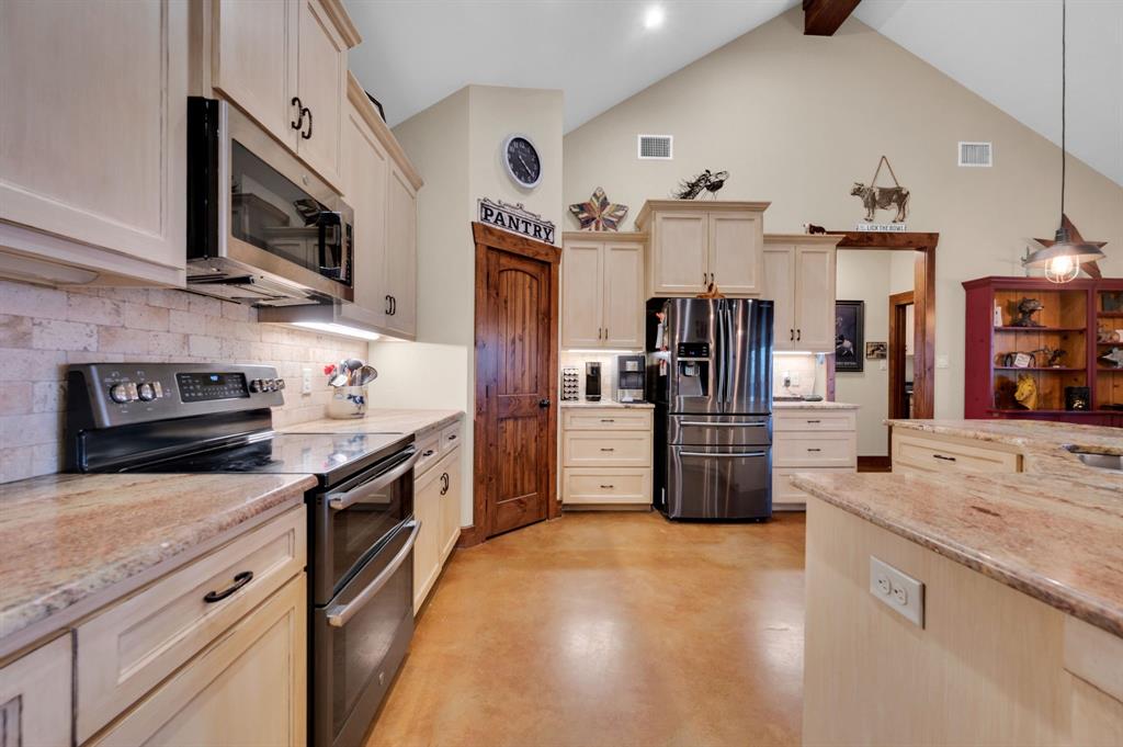 751 Sullivan Road Ennis, TX 75119 - Photo 12 of 38 Beautiful custom kitchen with granite counters. Big pantry and a second pantry closet is in laundry room.