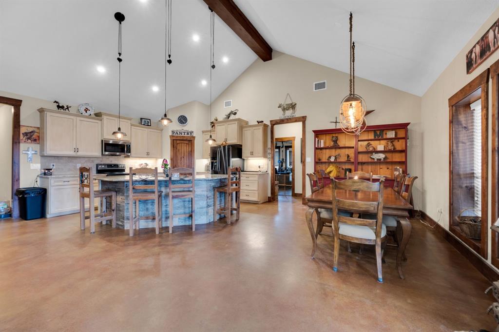 751 Sullivan Road Ennis, TX 75119 - Photo 6 of 38 Easy to maintain stained concrete floors are perfect for this country life.