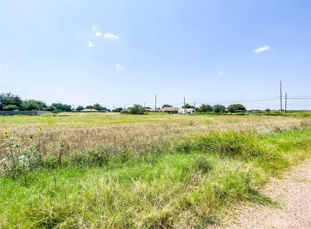 a view of a lake with a big yard