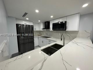 Flagami Miami, FL 33126 - Photo 2 of 13 a kitchen with stainless steel appliances a refrigerator sink and microwave