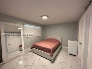 Flagami Miami, FL 33126 - Photo 5 of 13 a spacious bedroom with a bed and a cabinets