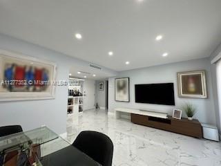 Flagami Miami, FL 33126 - Photo 9 of 13 a living room with furniture and a flat screen tv