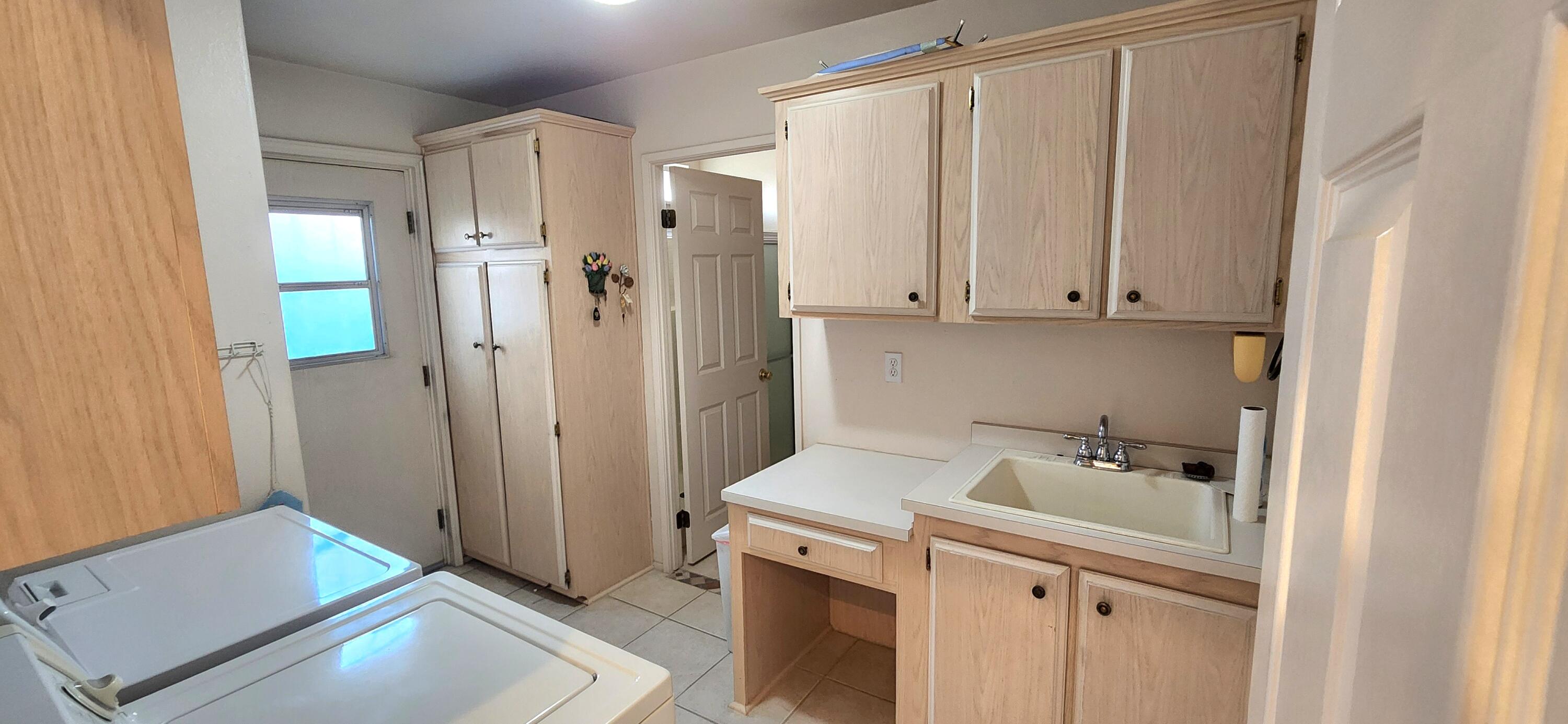73594 Cabazon Peak Drive Palm Desert, CA 92260 - Photo 20 of 32 Laundry w/sink and storage