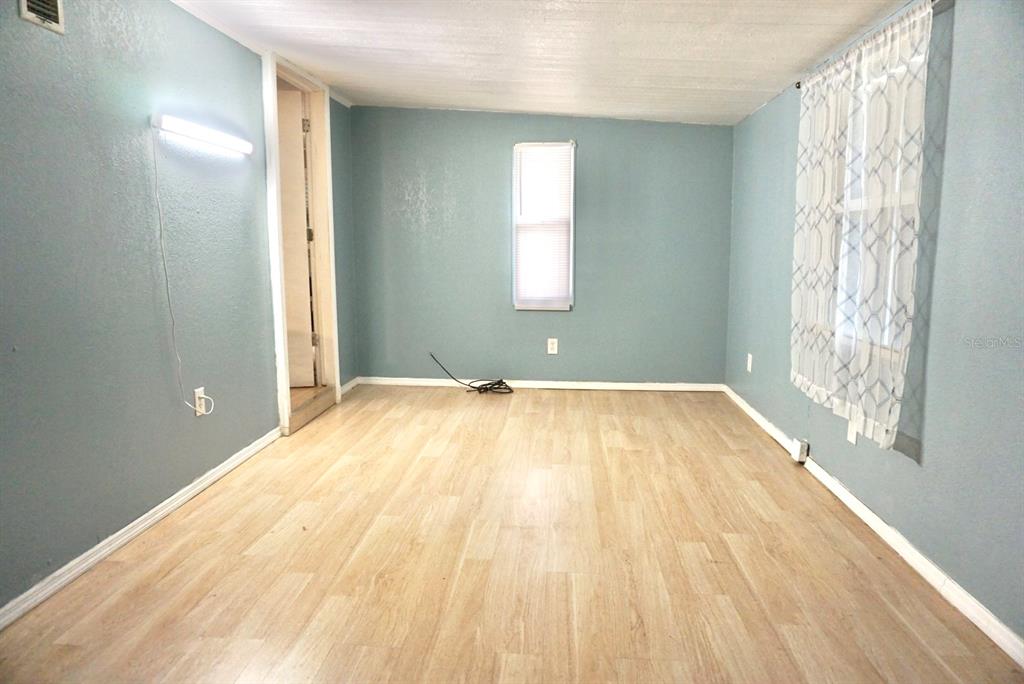 980 7th Street Northwest, Unit 71 Largo, FL 33770 - Photo 12 of 23 a view of a room with wooden floor and window