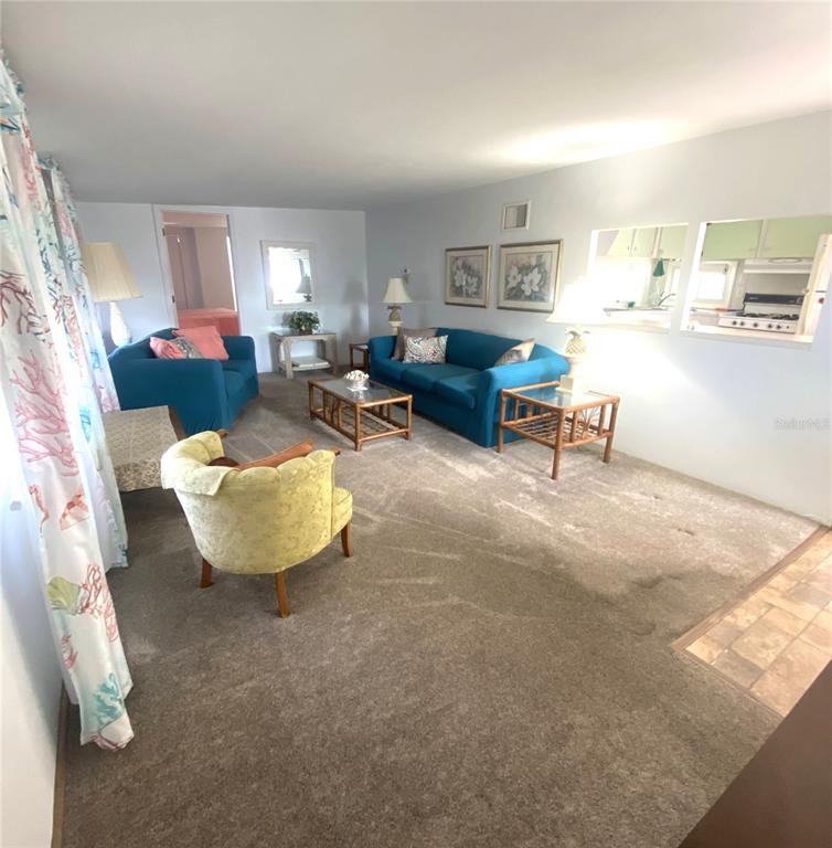 6618 Oregon Street Bradenton, FL 34207 - Photo 16 of 43 a living room with furniture and a large window