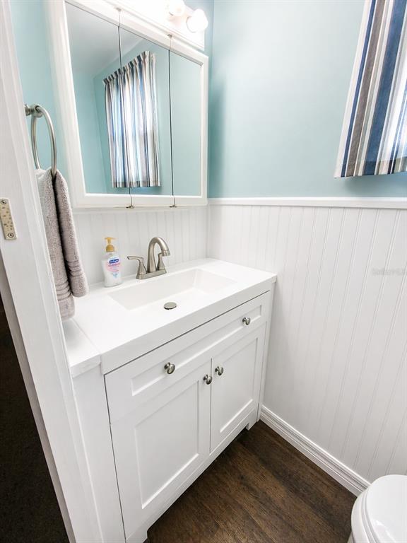 6618 Oregon Street Bradenton, FL 34207 - Photo 16 of 35 a bathroom with a sink and a mirror