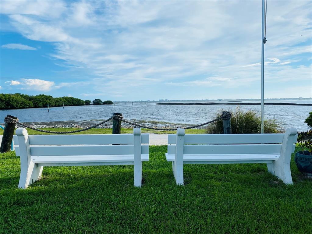 6618 Oregon Street Bradenton, FL 34207 - Photo 18 of 35 a view of a bench in the garden near a lake