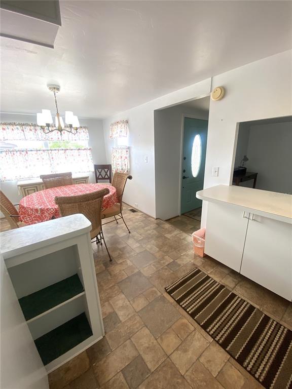 6618 Oregon Street Bradenton, FL 34207 - Photo 20 of 43 a living room with furniture and a flat screen tv