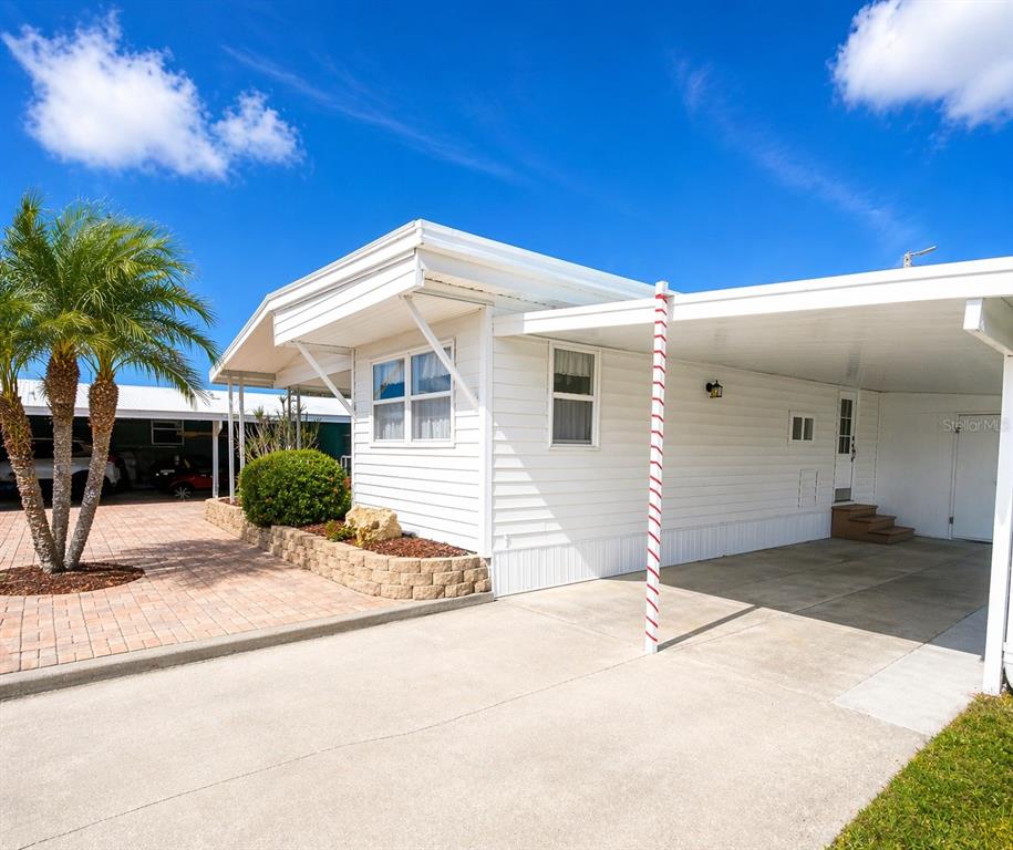 6618 Oregon Street Bradenton, FL 34207 - Photo 2 of 35 a view of a house with a patio