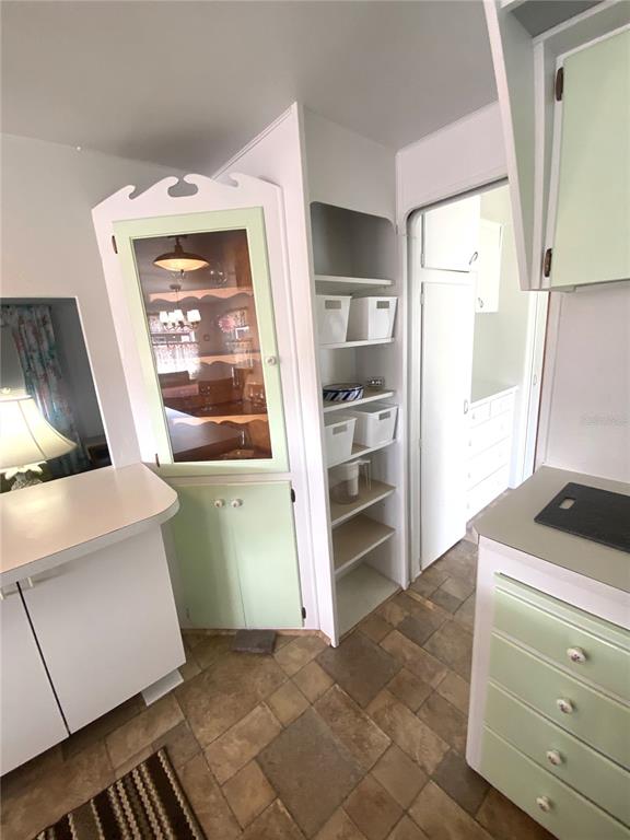 6618 Oregon Street Bradenton, FL 34207 - Photo 24 of 43 a kitchen with a refrigerator and window